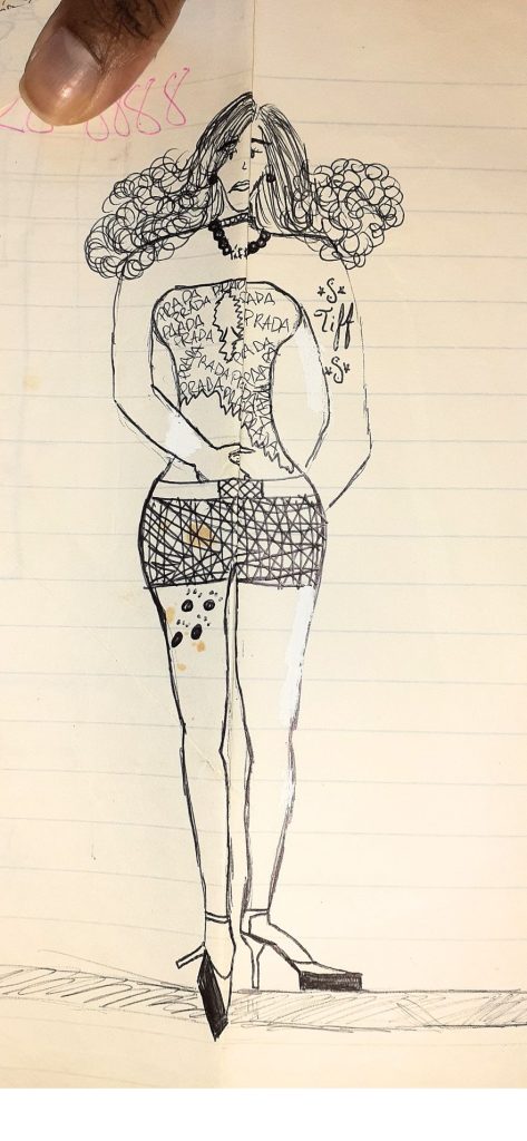 “Childhood fashion sketch of an outfit with short shorts and a Prada-printed crop top, hand-drawn on notebook paper”